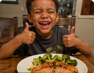A smiling child giving thumbs up over a plate of salmon